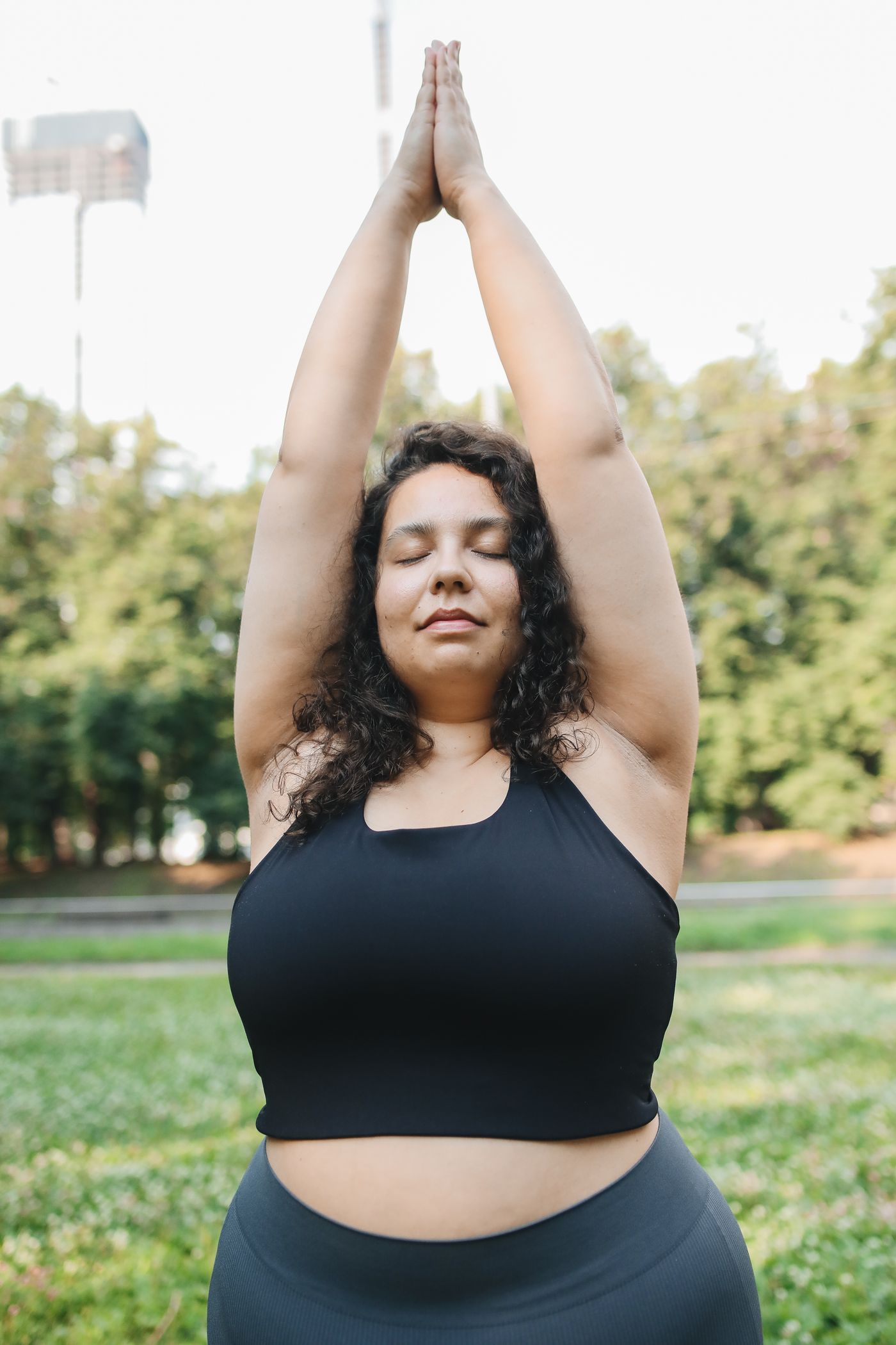 Woman practising yoga outdoors